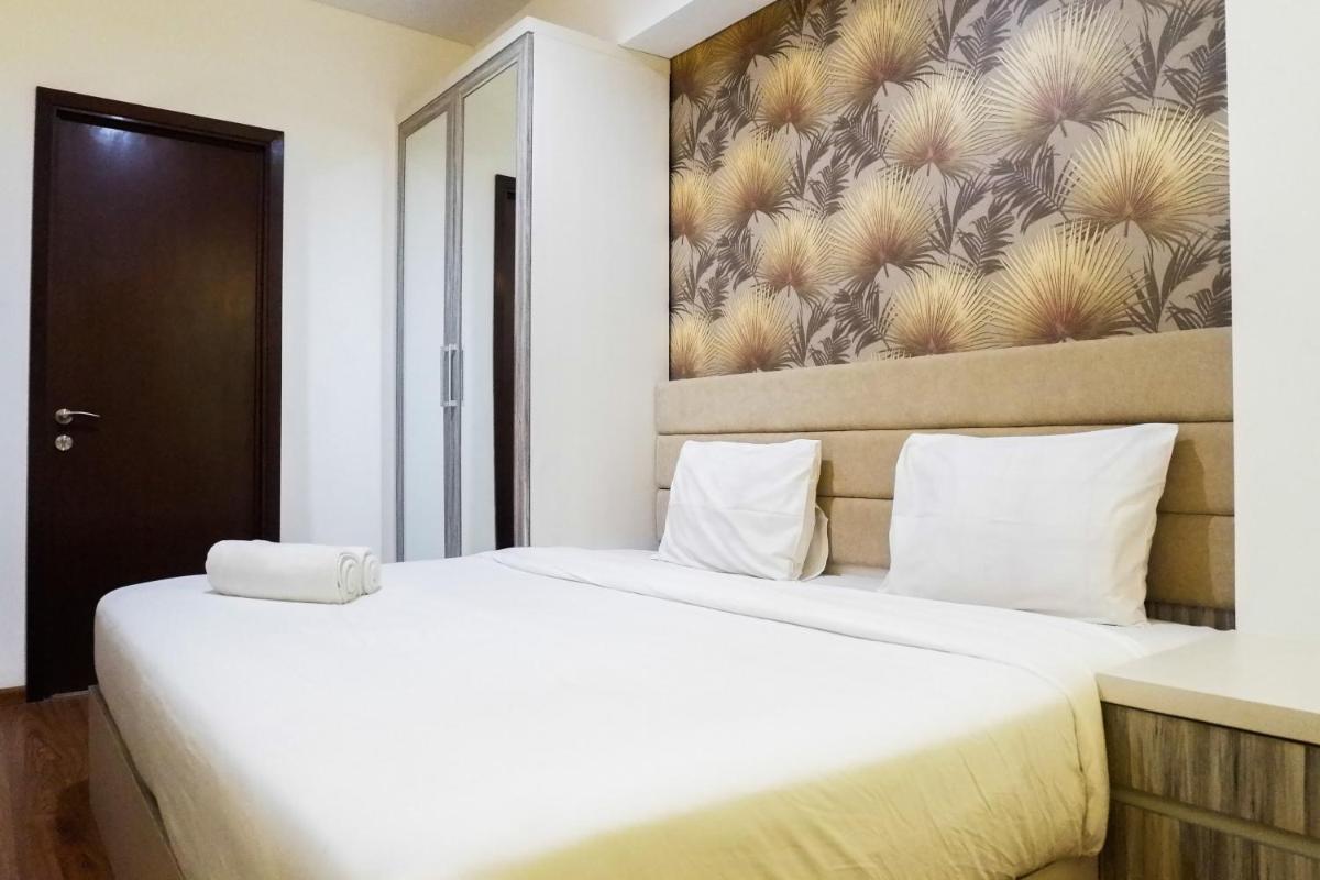 Premium 1BR Apartement At Grand Sungkono Lagoon By Travelio - Housity