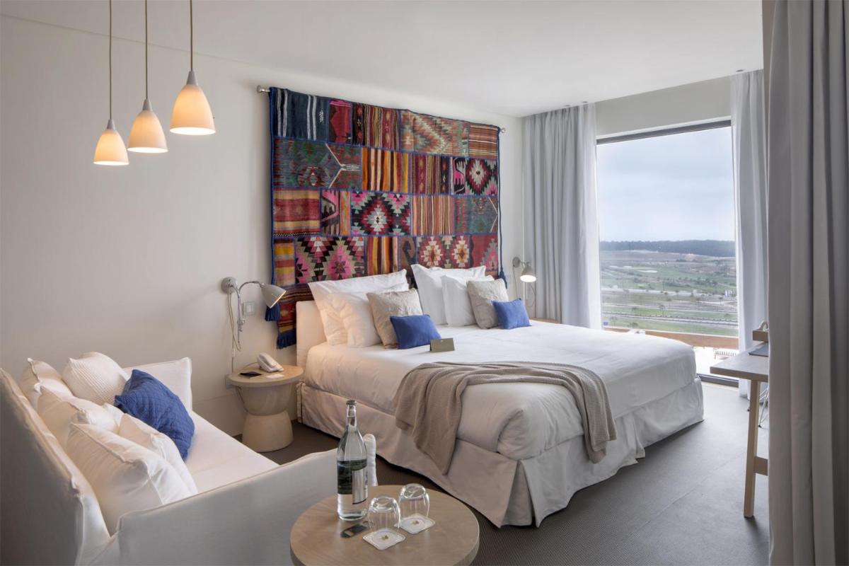 Uma cama ou camas num quarto em Royal Obidos Scenic Resort