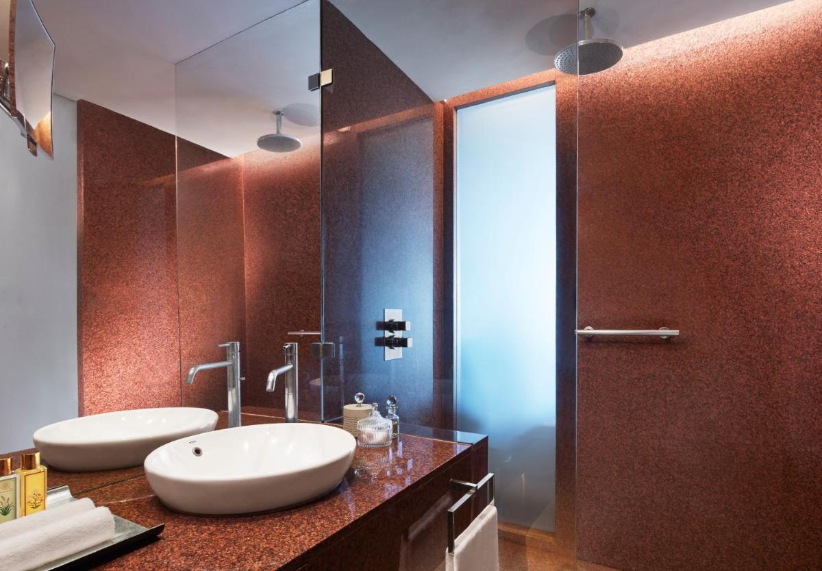 a bathroom with two sinks and a shower at President - IHCL SeleQtions in Mumbai