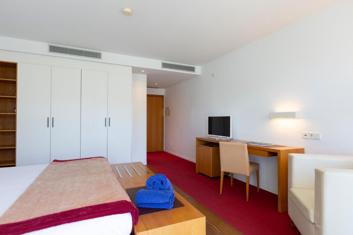 Cama o camas de una habitación en Aimia Hotel