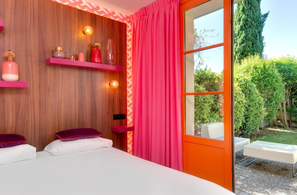 Un ou plusieurs lits dans un hébergement de l'établissement Hôtel Montmorency & Spa