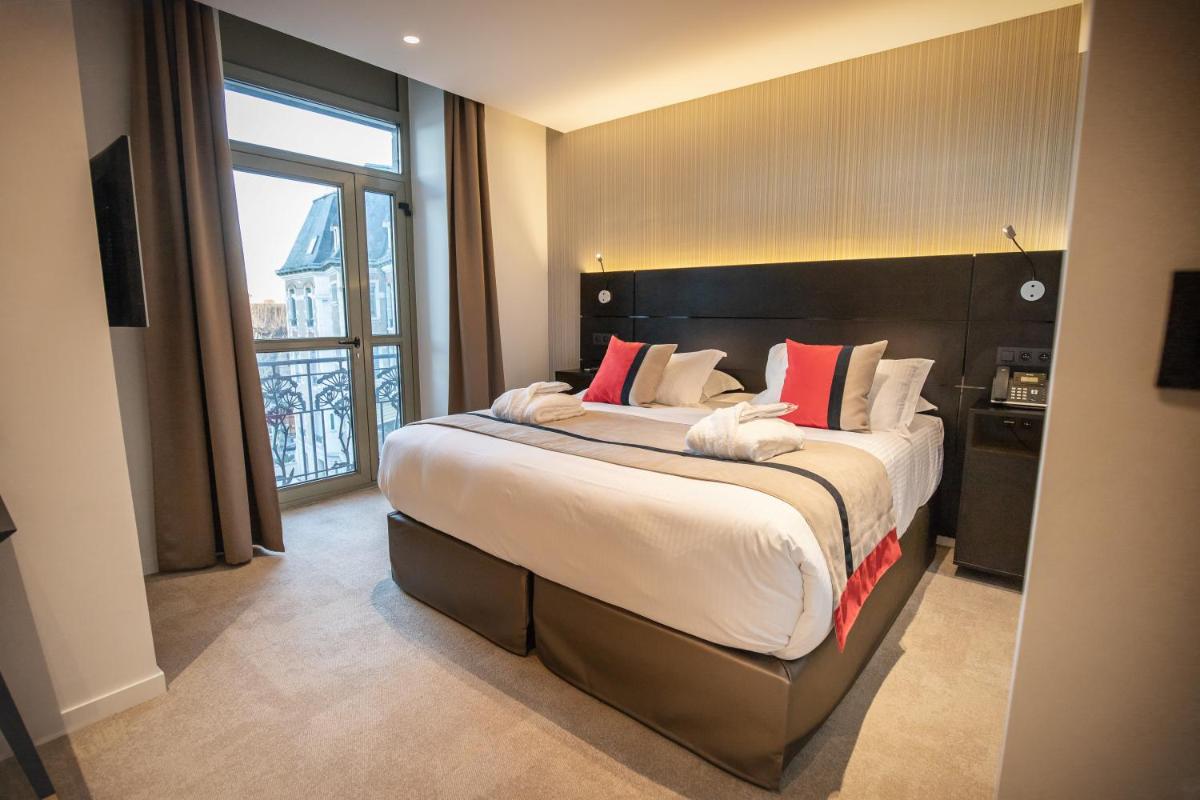 Un ou plusieurs lits dans un hébergement de l'établissement HÔTEL & SPA Panorama 360