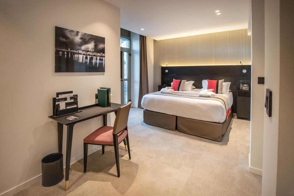 Un ou plusieurs lits dans un hébergement de l'établissement HÔTEL & SPA Panorama 360
