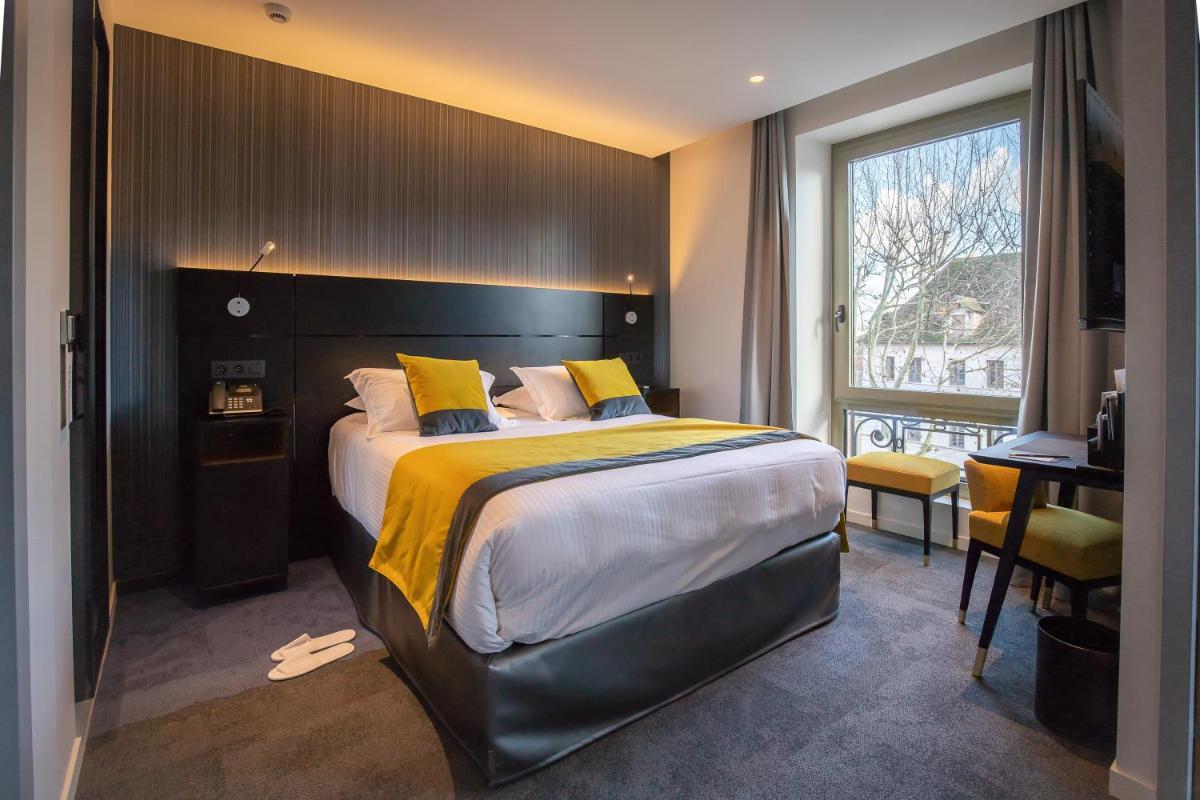 Un ou plusieurs lits dans un hébergement de l'établissement HÔTEL & SPA Panorama 360