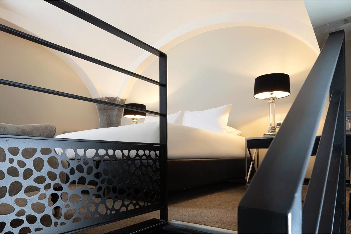 Un ou plusieurs lits dans un hébergement de l'établissement Royal Hainaut Spa & Resort Hotel
