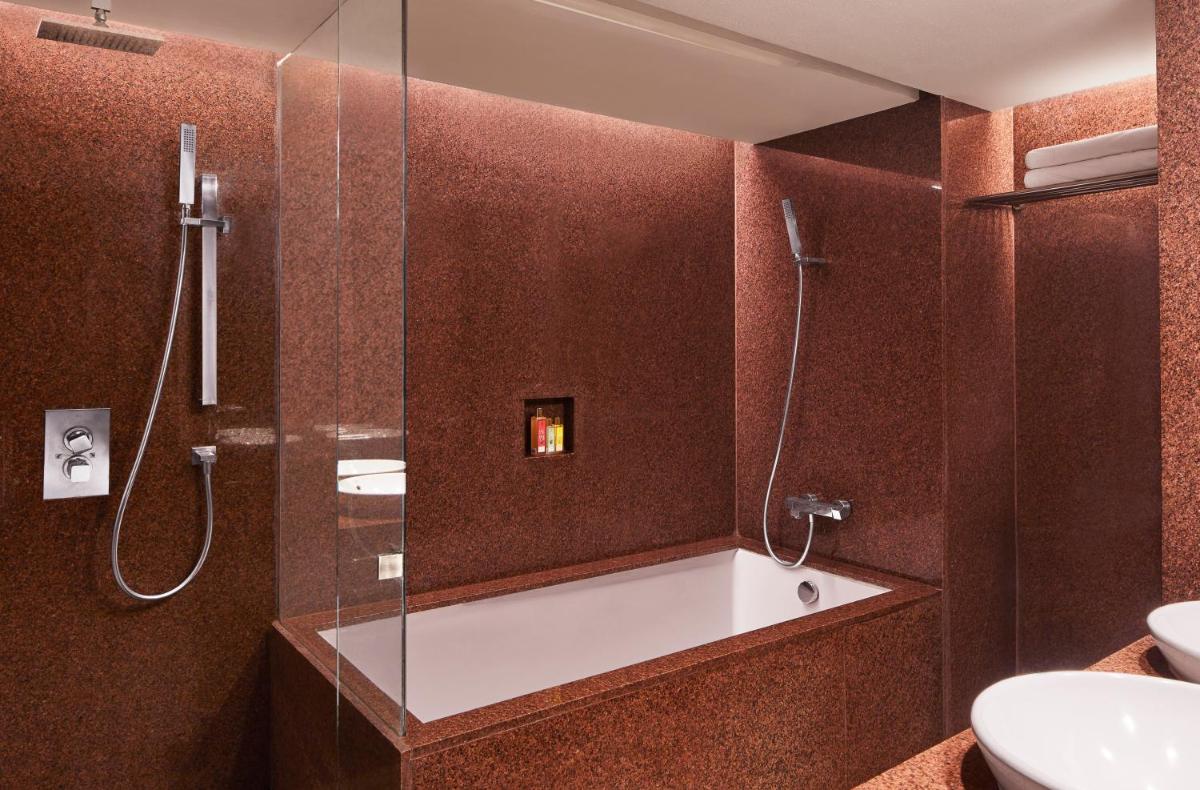 a bathroom with a shower and a sink at President - IHCL SeleQtions in Mumbai +56 photos