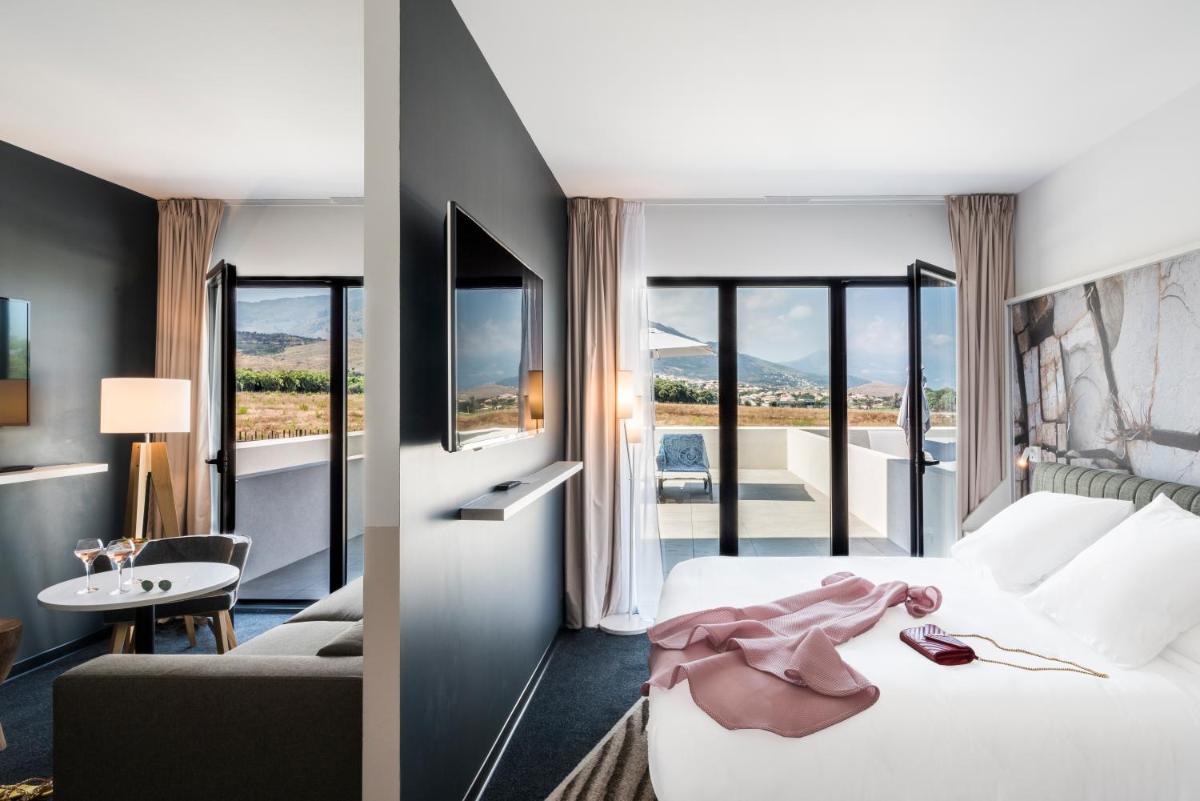 Un ou plusieurs lits dans un hébergement de l'établissement Mercure Hotel & Spa Bastia Biguglia