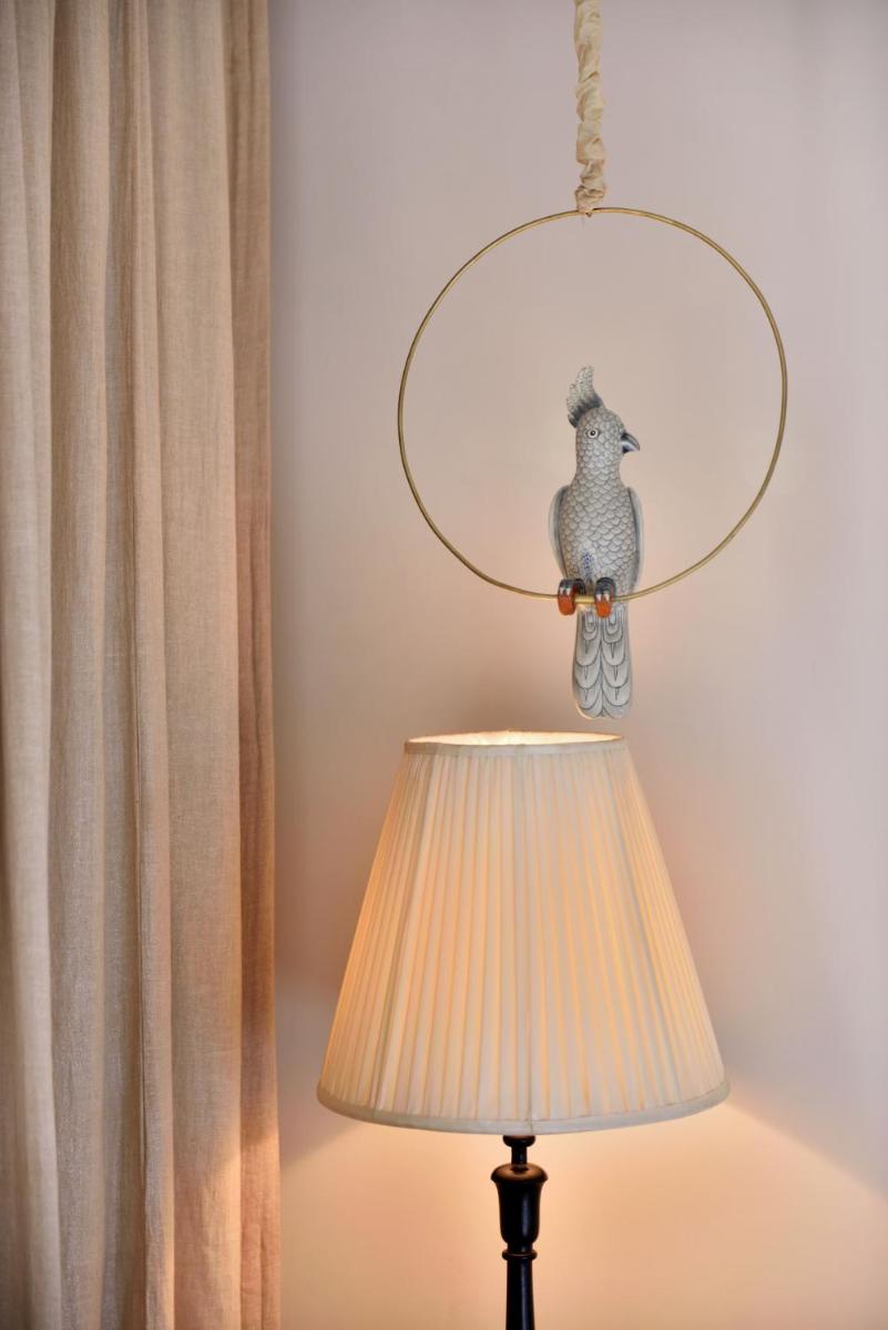 a lamp with a chicken hanging from a ceiling at Fairmont Jaipur in Jaipur