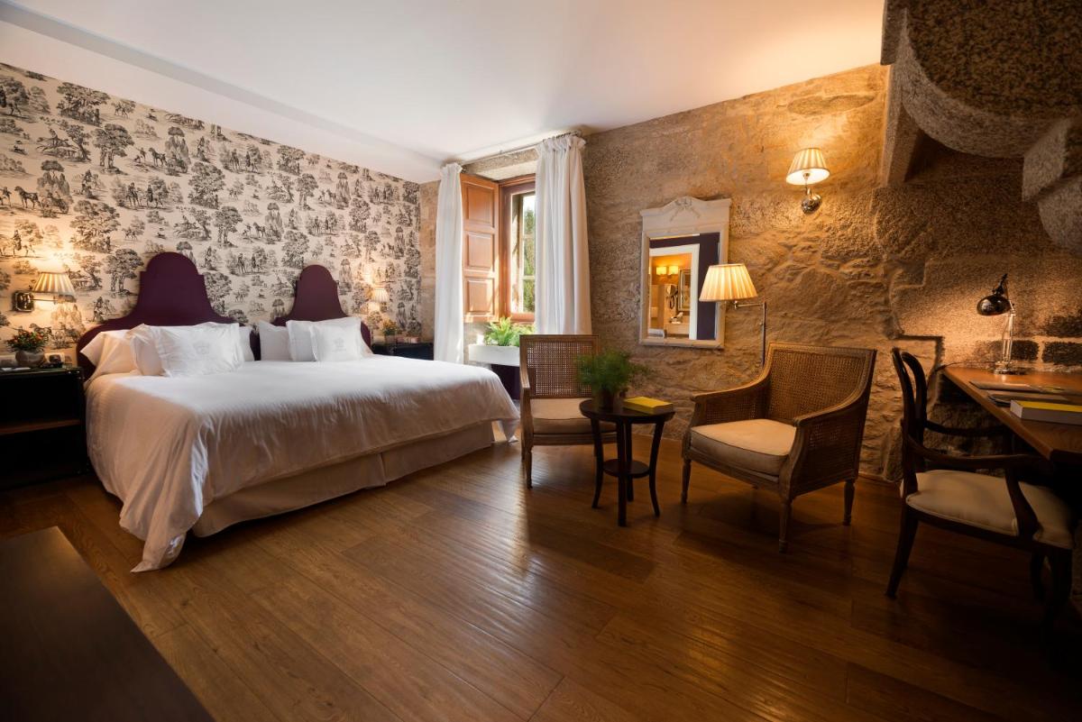 Cama o camas de una habitación en A Quinta Da Auga Hotel Spa Relais & Chateaux