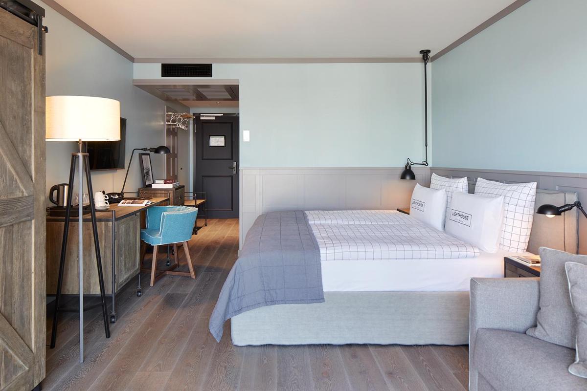 Ein Bett oder Betten in einem Zimmer der Unterkunft Lighthouse Hotel & Spa