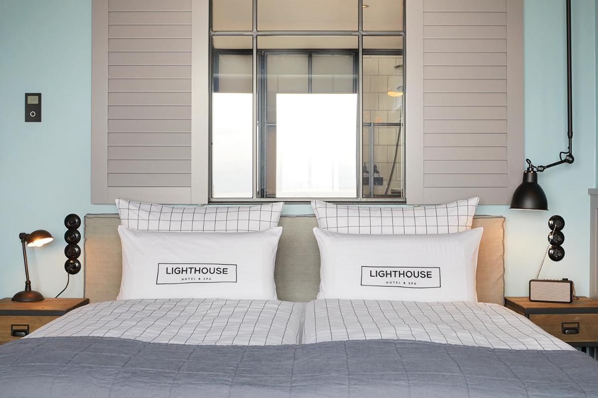 Ein Bett oder Betten in einem Zimmer der Unterkunft Lighthouse Hotel & Spa