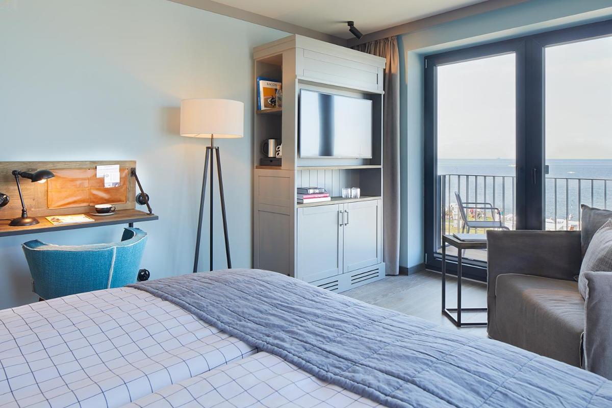 Ein Bett oder Betten in einem Zimmer der Unterkunft Lighthouse Hotel & Spa