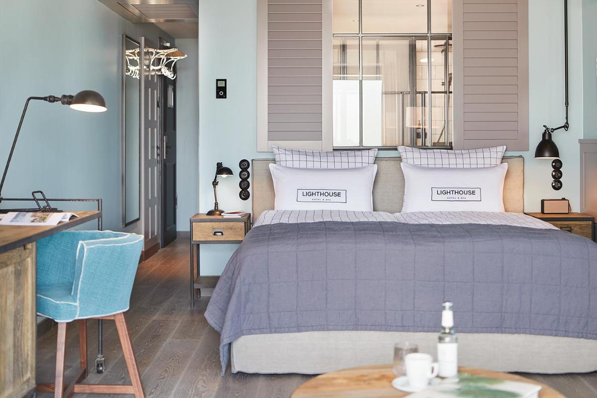 Ein Bett oder Betten in einem Zimmer der Unterkunft Lighthouse Hotel & Spa
