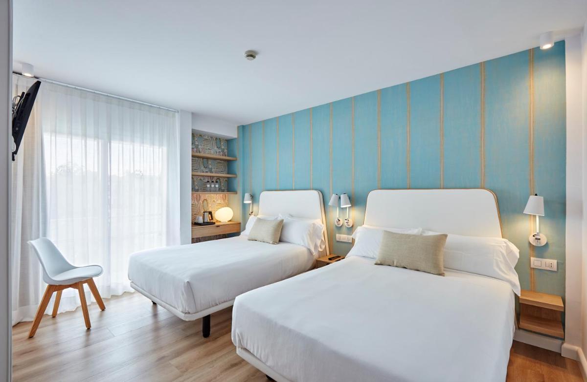 Cama o camas de una habitación en Hotel Anabel