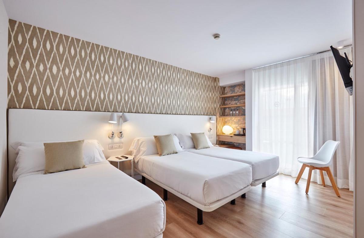 Cama o camas de una habitación en Hotel Anabel