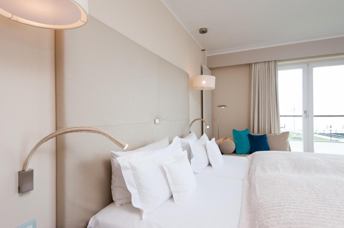 Ein Bett oder Betten in einem Zimmer der Unterkunft Hotel Fährhaus