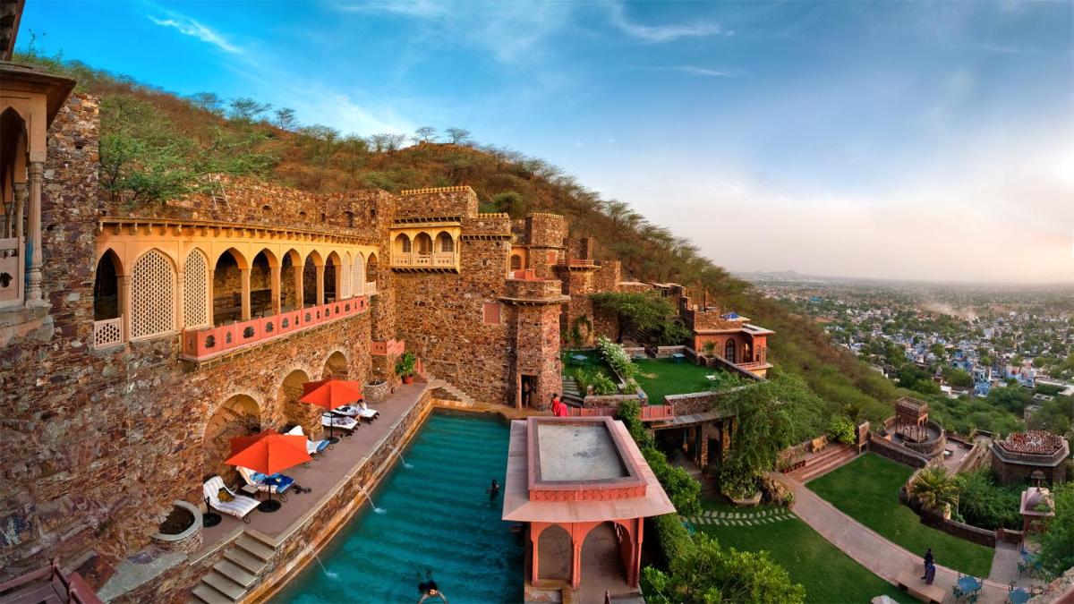 an aerial view of a castle with a pool at Neemrana Fort-Palace in Neemrana