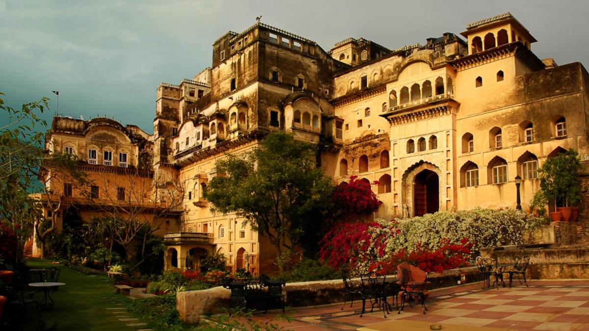 a large building with a courtyard in front of it at Neemrana Fort-Palace in Neemrana