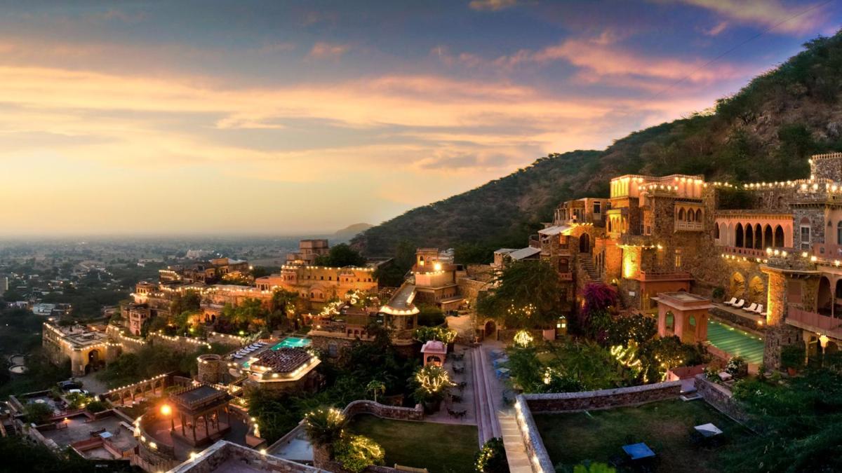 an aerial view of a city at night at Neemrana Fort-Palace in Neemrana
