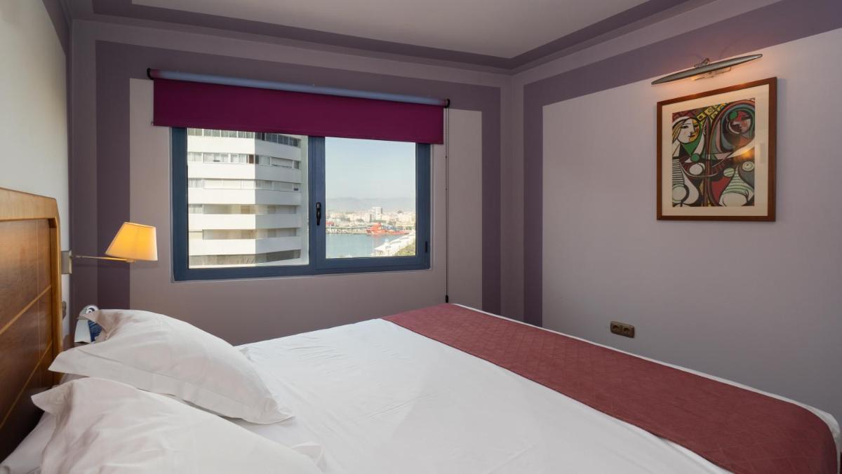 Cama o camas de una habitación en Hotel MS Maestranza Málaga