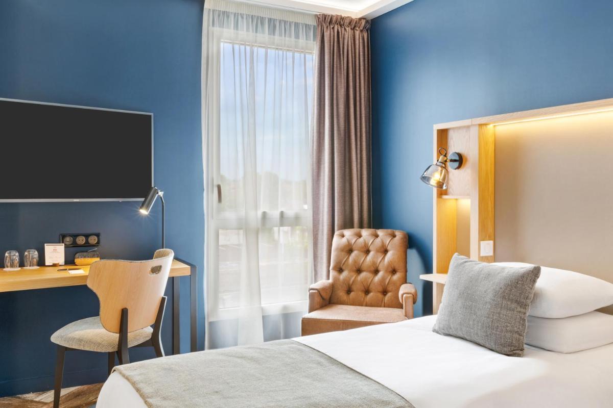 Un ou plusieurs lits dans un hébergement de l'établissement Aiden by Best Western T'aim Hotel & SPA
