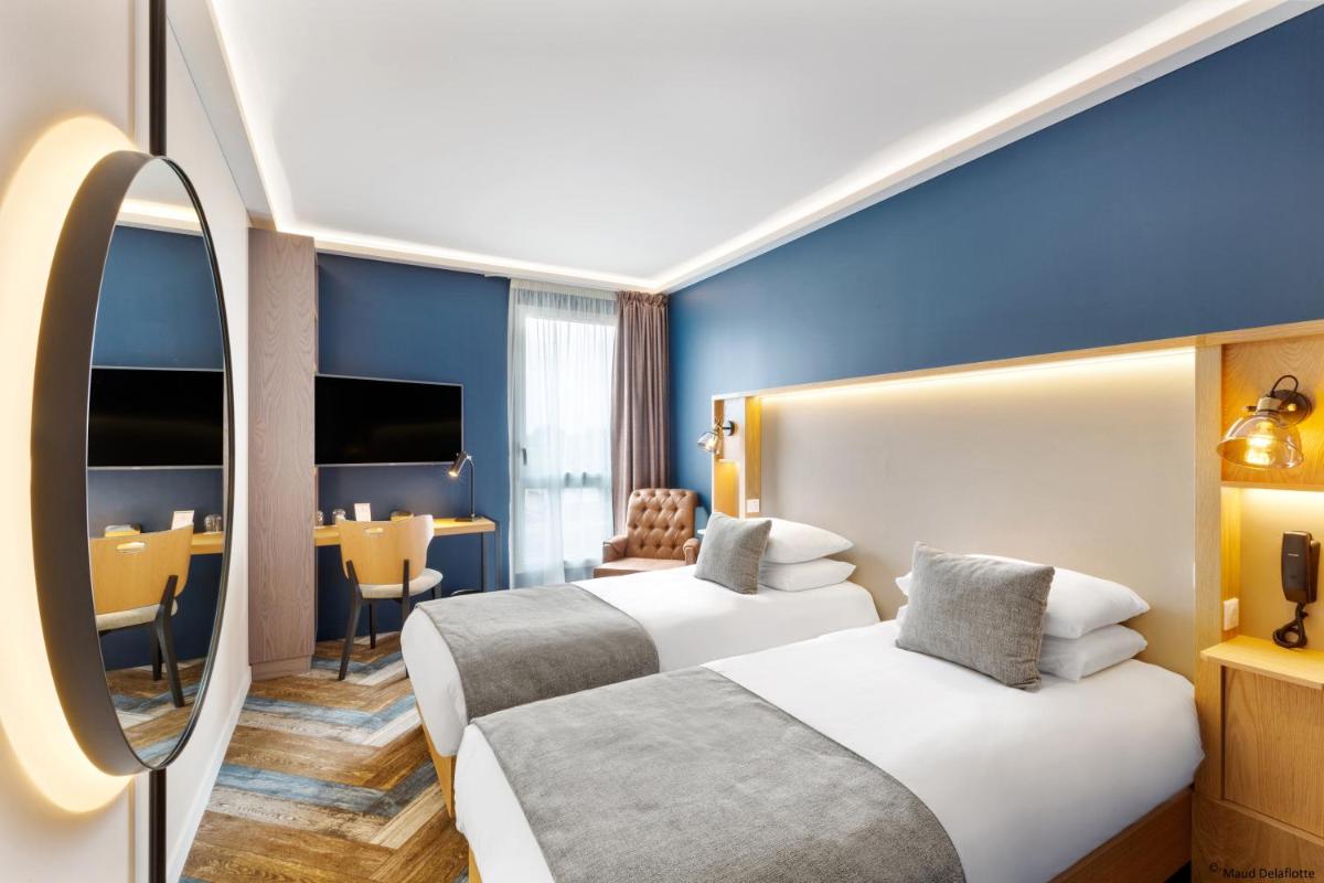 Un ou plusieurs lits dans un hébergement de l'établissement Aiden by Best Western T'aim Hotel & SPA