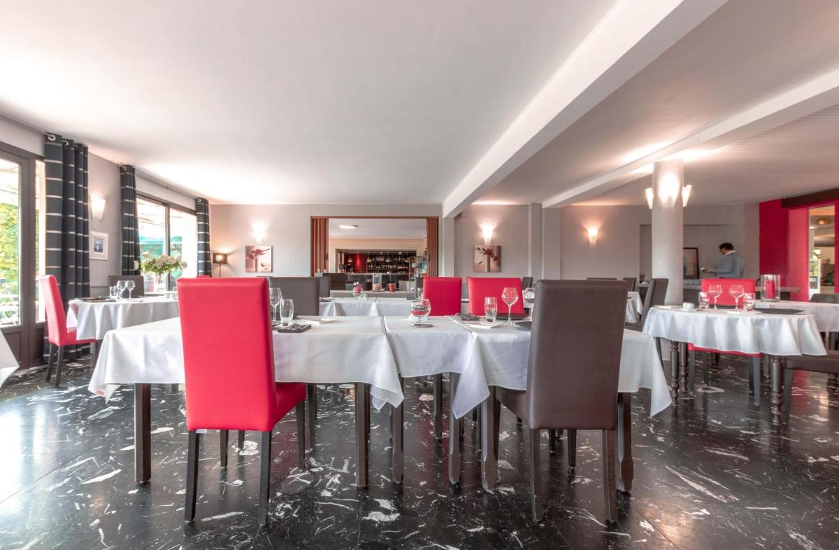 Coin salon dans l'établissement Auberge Du Camp Romain