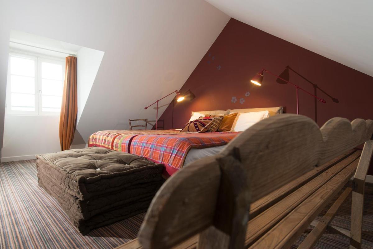 Un ou plusieurs lits dans un hébergement de l'établissement La Marine de Loire Hôtel & Spa