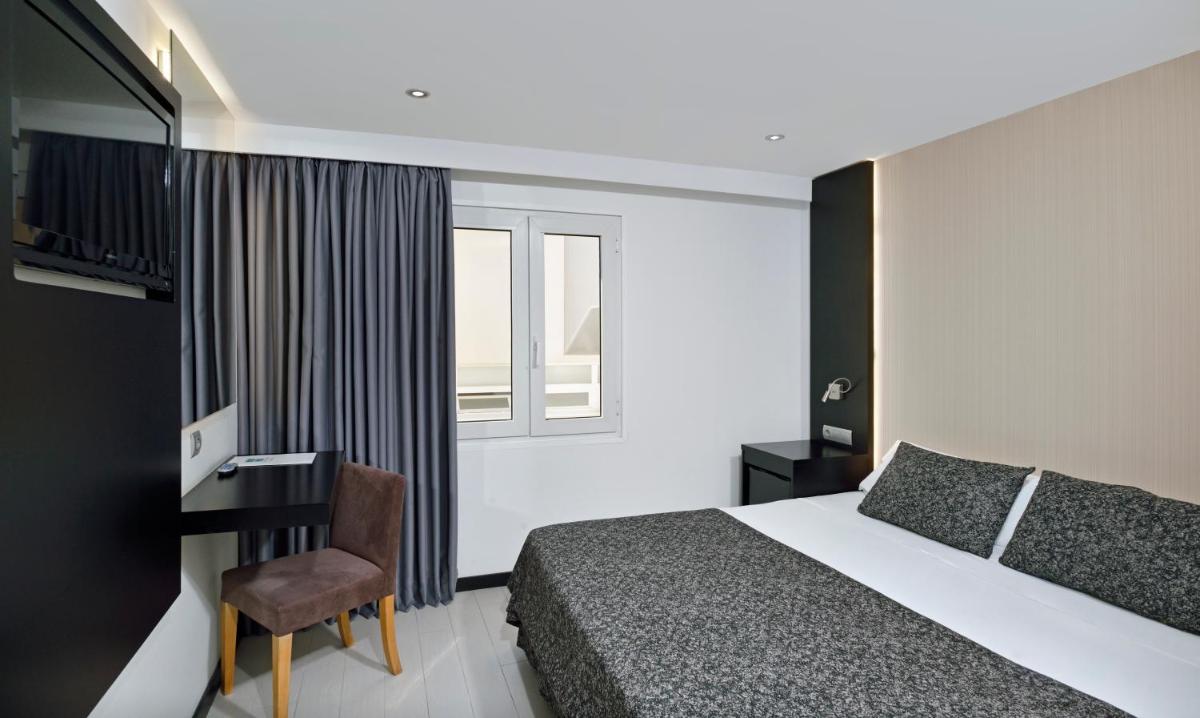 Cama o camas de una habitación en Hotel Hispania