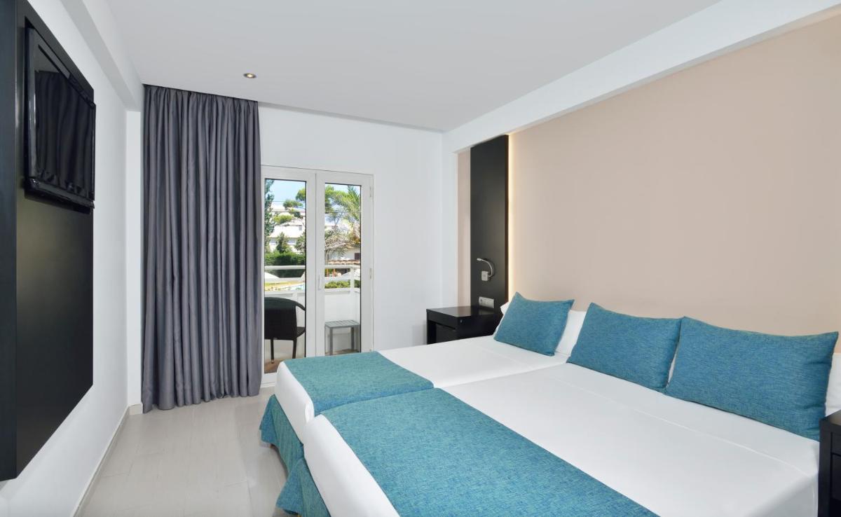 Cama o camas de una habitación en Hotel Hispania