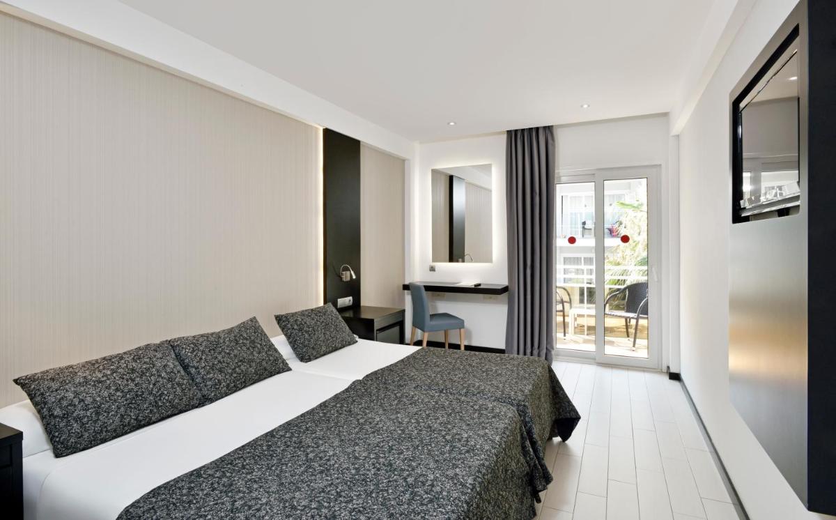 Cama o camas de una habitación en Hotel Hispania