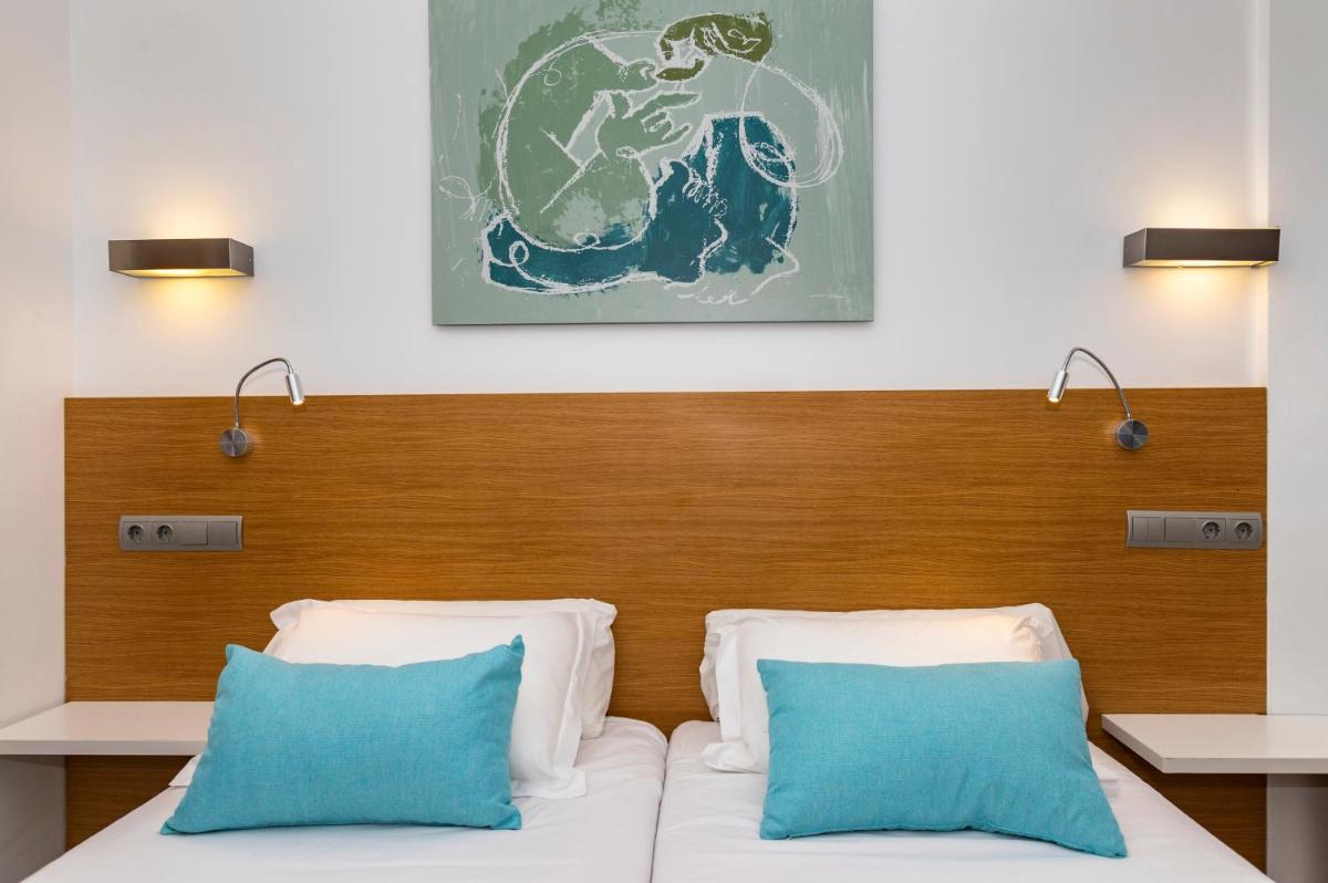 Cama o camas de una habitación en Houm Plaza Son Rigo