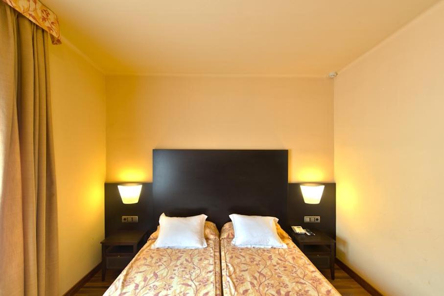 Cama o camas de una habitación en Hotel Restaurant Pessets & SPA