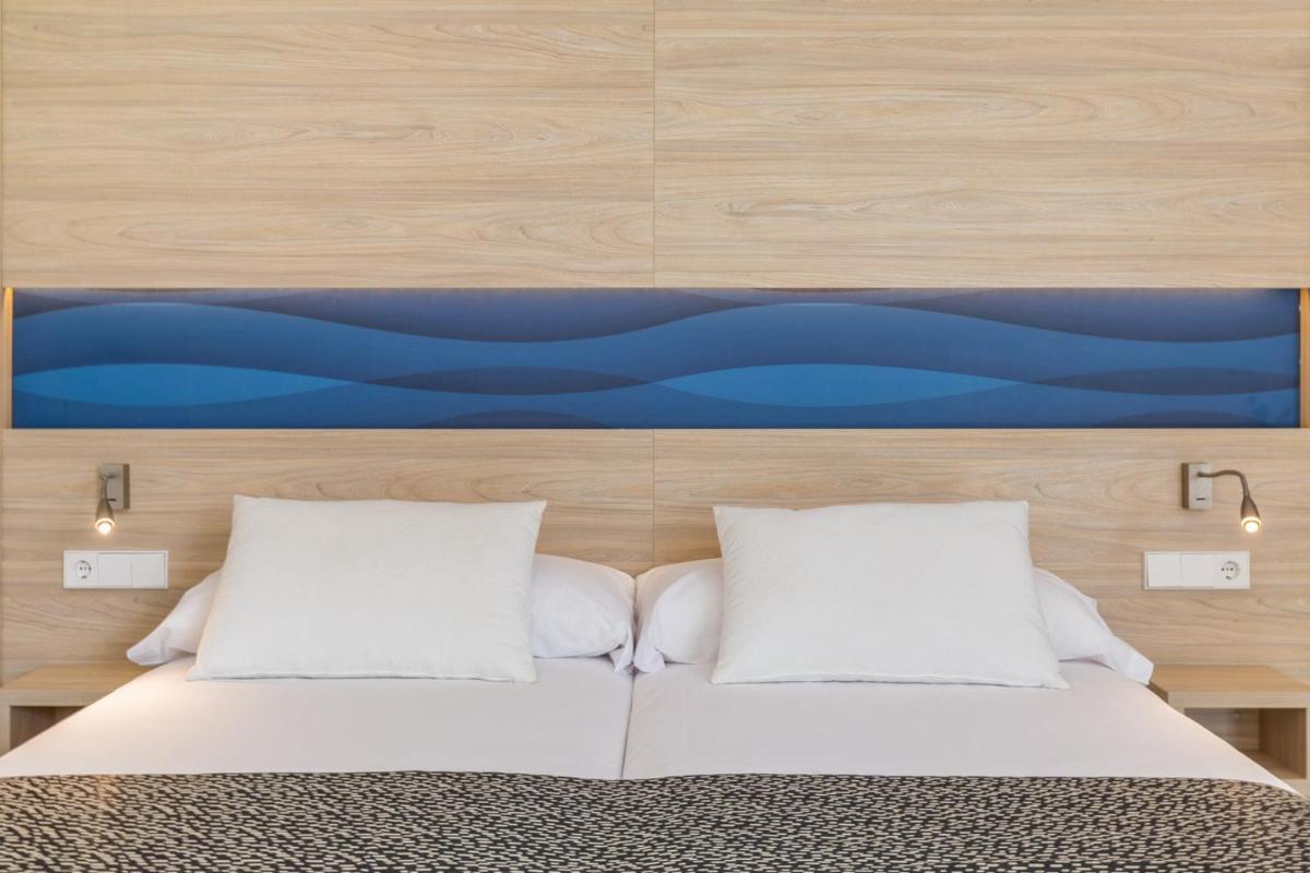 Cama o camas de una habitación en Hotel Samos