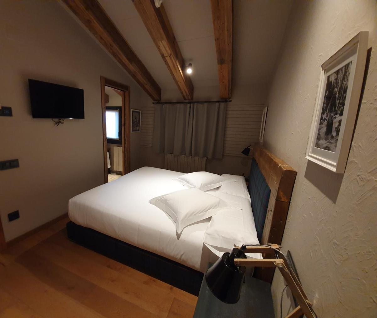 Cama o camas de una habitación en Hotel Boutique Puig Francó - Adults Only