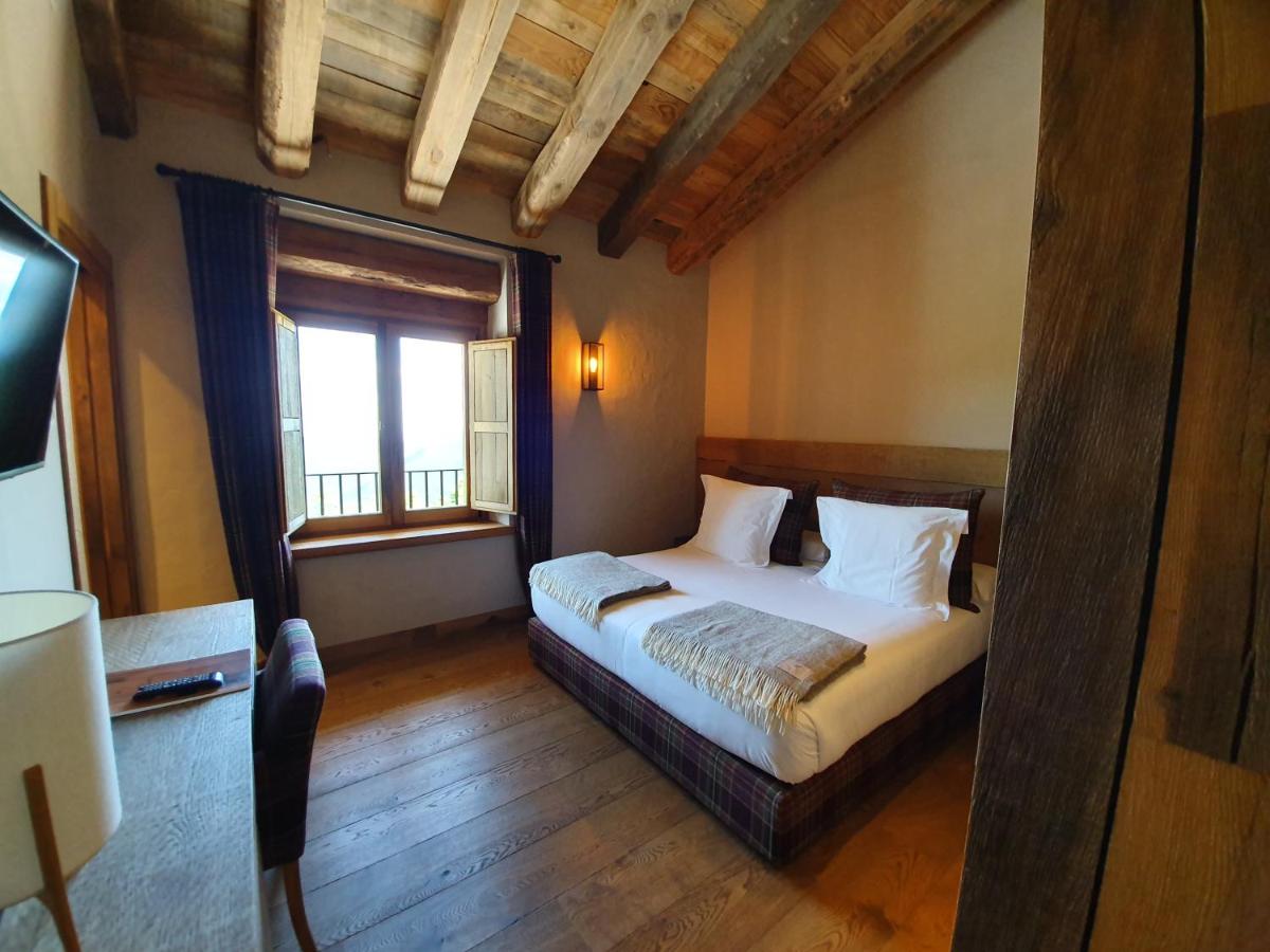 Cama o camas de una habitación en Hotel Boutique Puig Francó - Adults Only