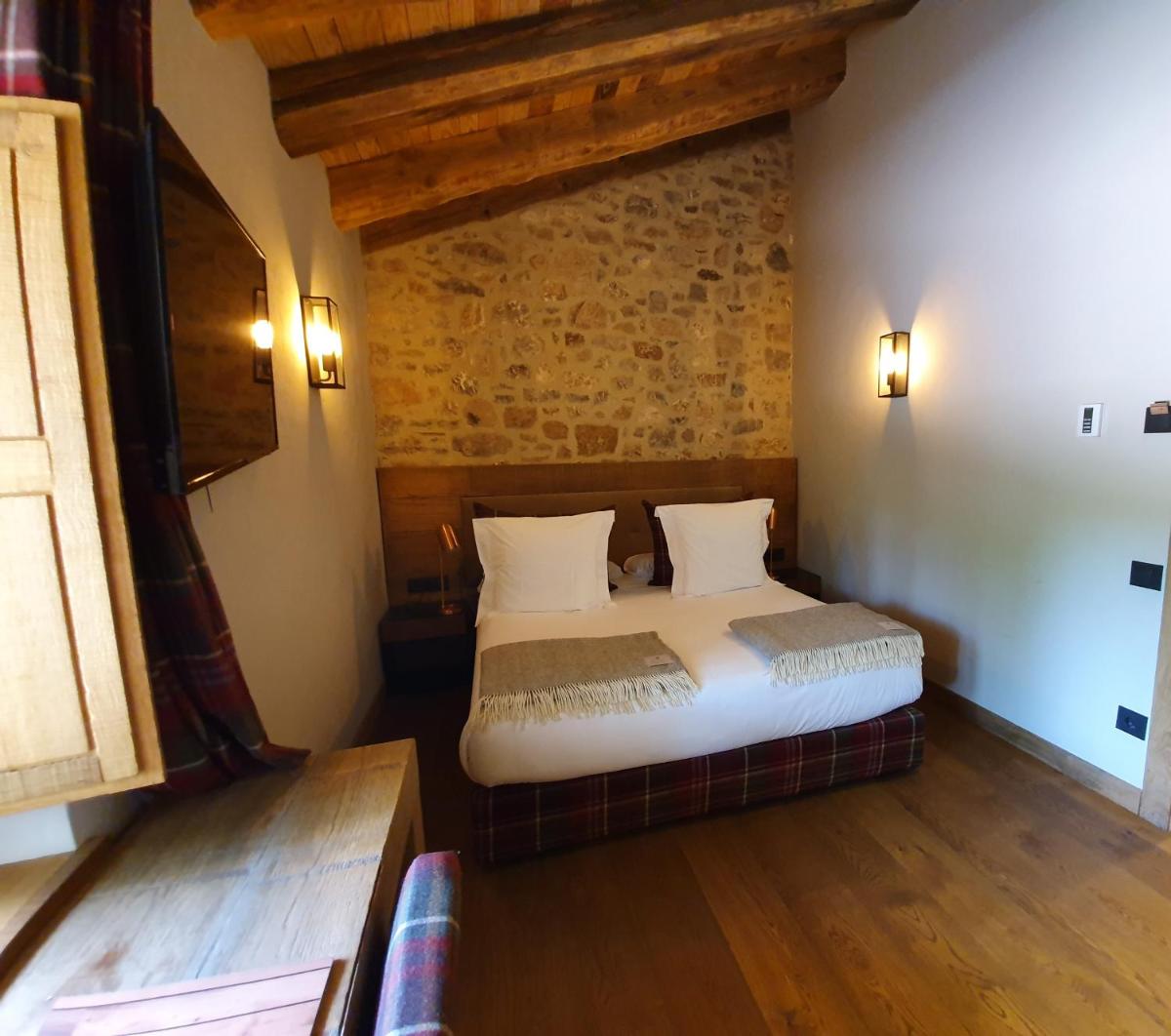 Cama o camas de una habitación en Hotel Boutique Puig Francó - Adults Only