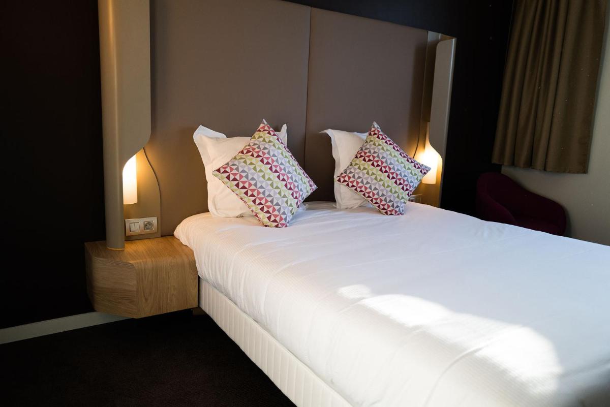 Un ou plusieurs lits dans un hébergement de l'établissement Hotel Campanile Montpellier Centre St Roch