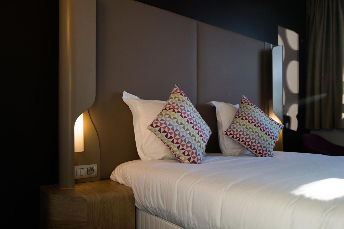 Un ou plusieurs lits dans un hébergement de l'établissement Hotel Campanile Montpellier Centre St Roch