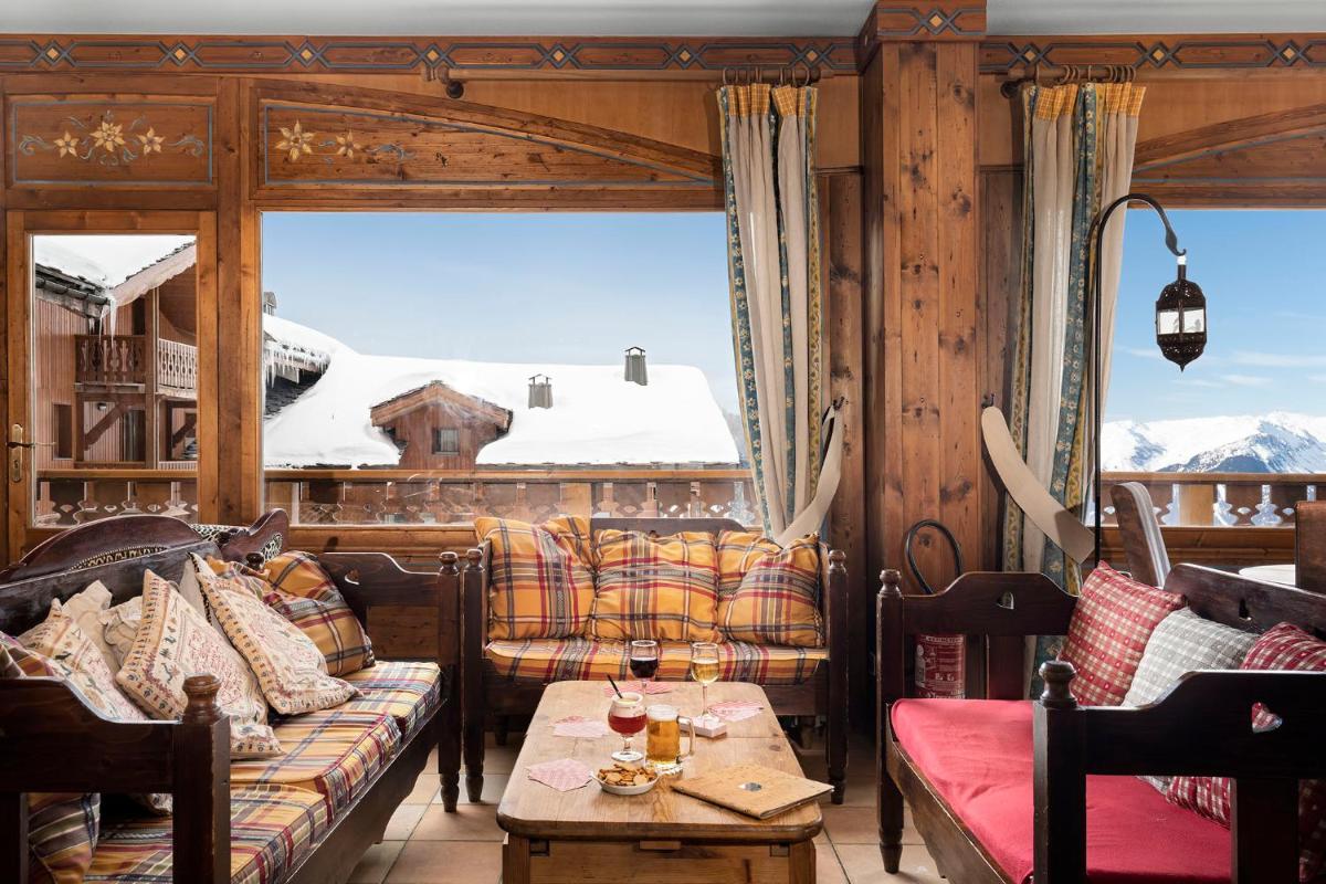 Coin salon dans l'établissement Hôtel Les Balcons Village