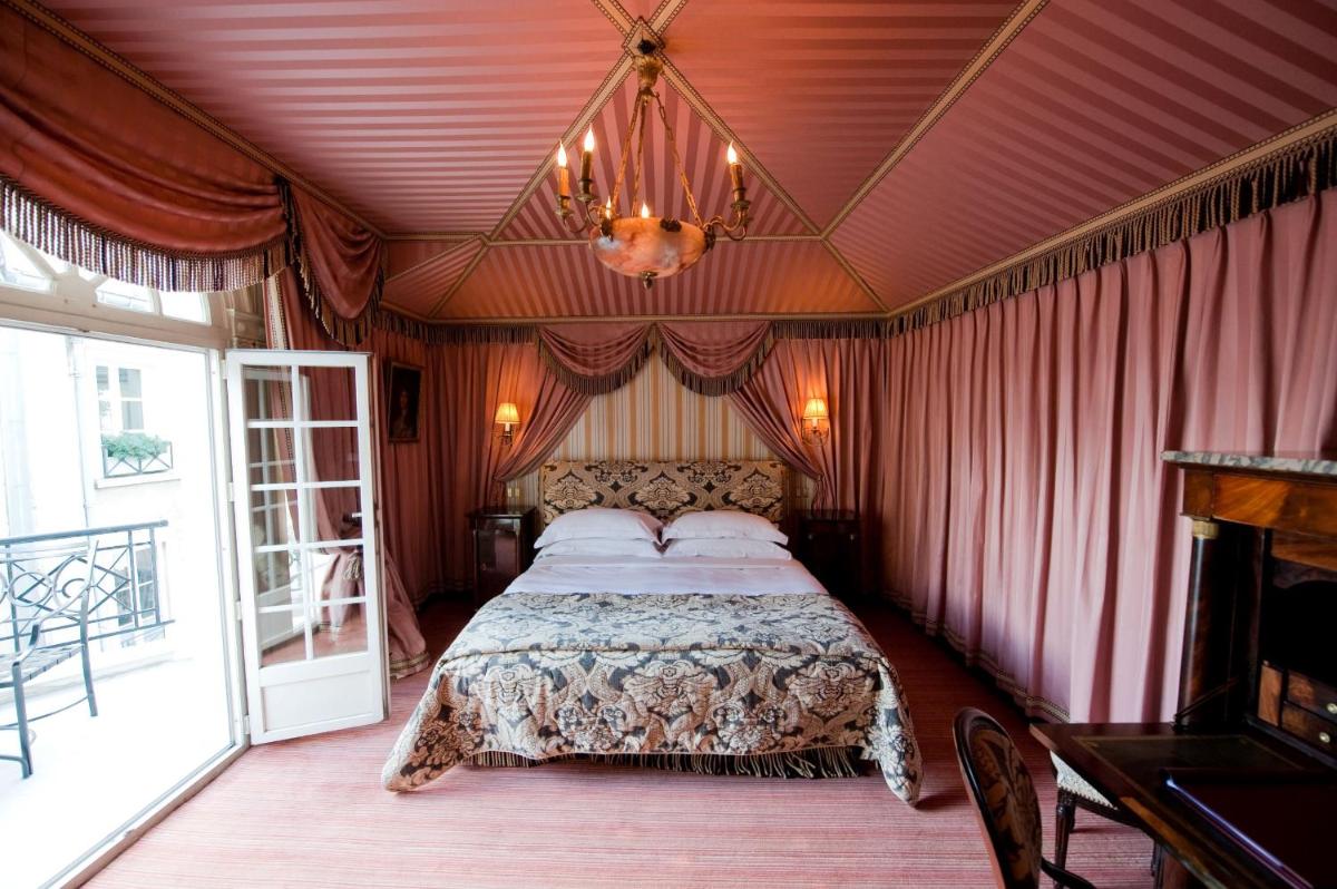 Un ou plusieurs lits dans un hébergement de l'établissement L'Hôtel