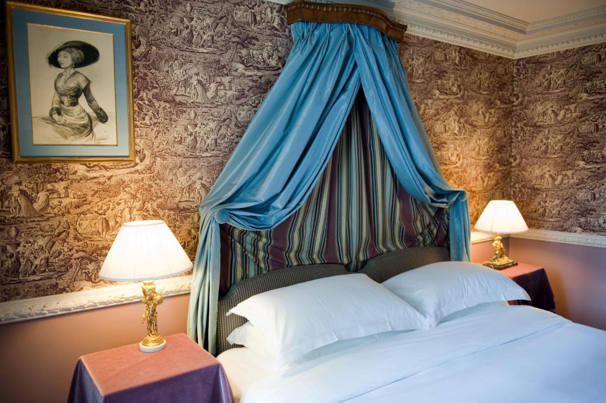 Un ou plusieurs lits dans un hébergement de l'établissement L'Hôtel