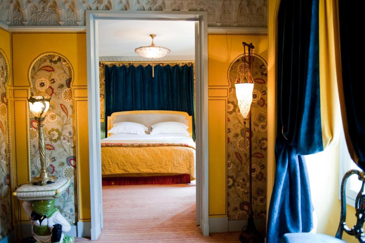 Un ou plusieurs lits dans un hébergement de l'établissement L'Hôtel