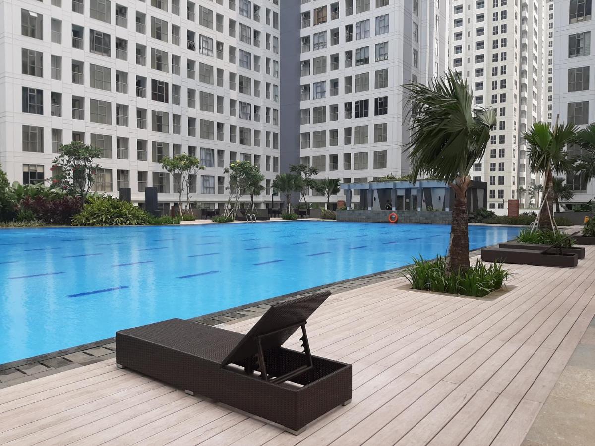 Homey Studio Apartment at M-Town Residence near Summarecon Mall Serpong By Travelio - Housity