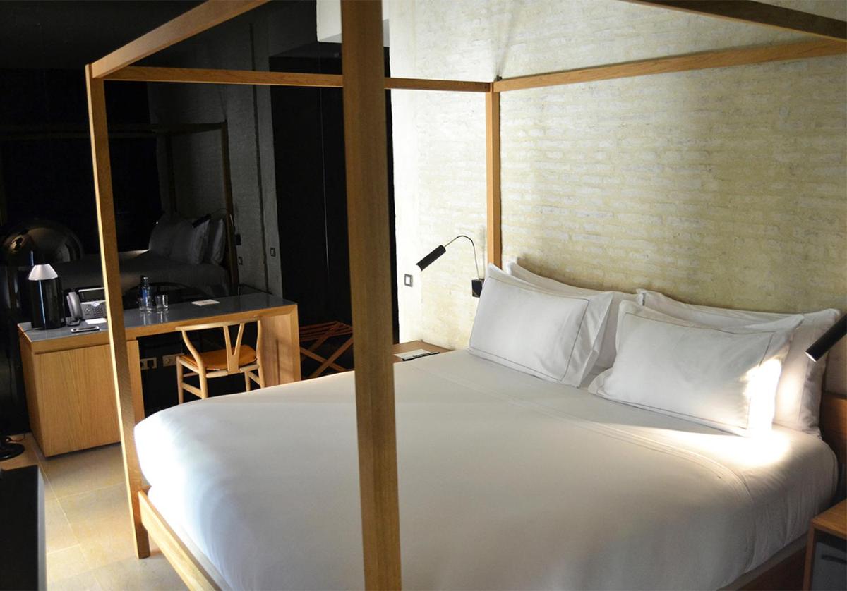 Cama o camas de una habitación en EME Catedral Mercer Hotel