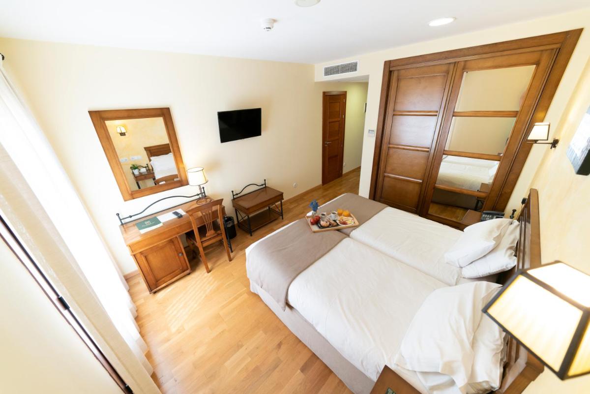 Cama o camas de una habitación en Hotel Comendador
