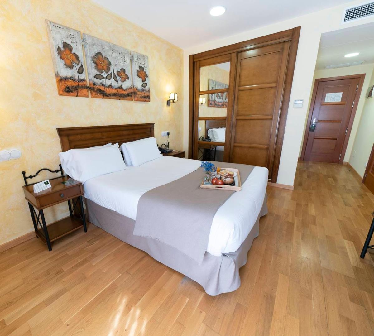 Cama o camas de una habitación en Hotel Comendador
