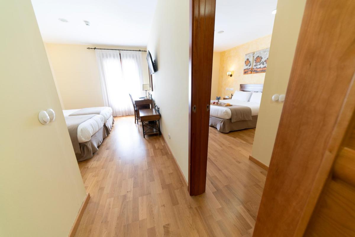 Cama o camas de una habitación en Hotel Comendador