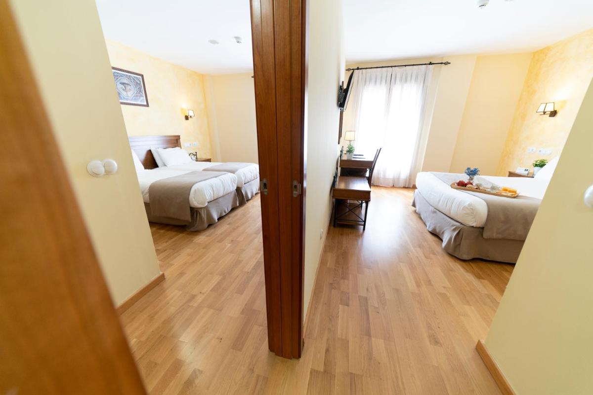 Cama o camas de una habitación en Hotel Comendador