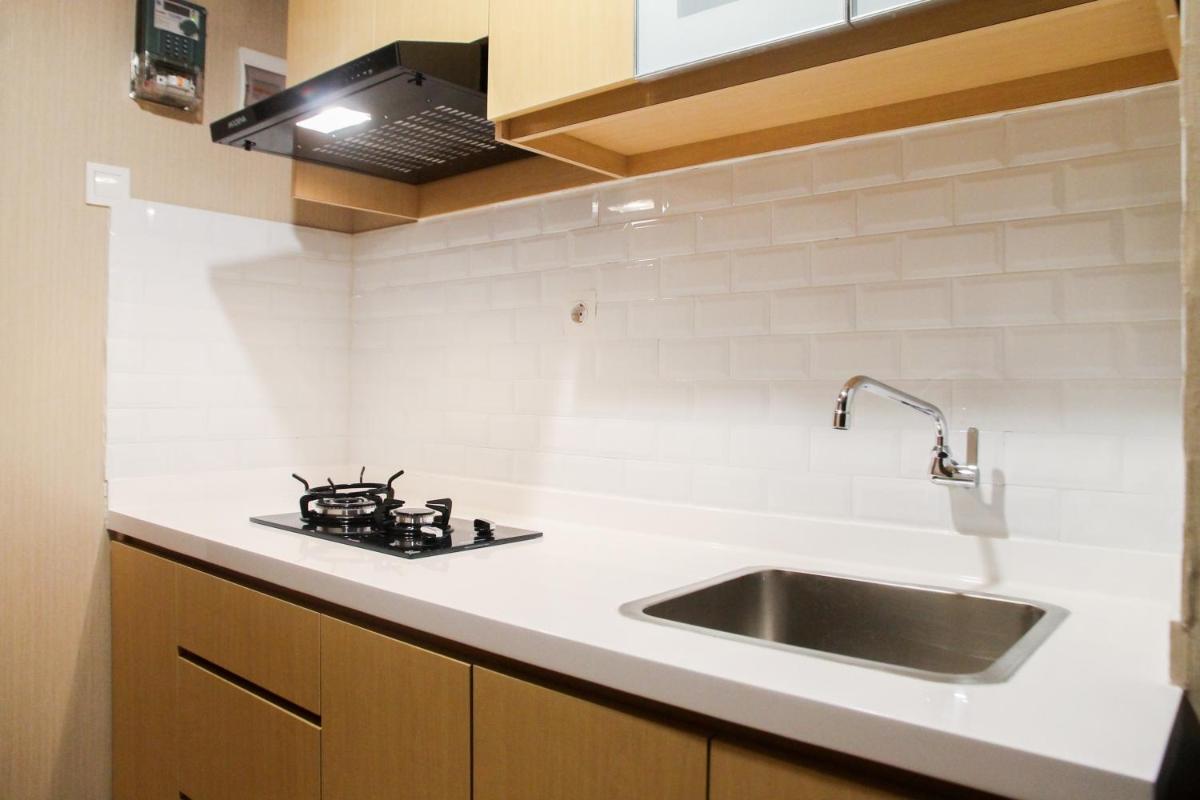 Cozy 1BR Apartment Grand Kamala Lagoon By Travelio - Housity